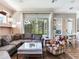 Bright living room with comfortable seating, a glass top coffee table, and plenty of natural light at 3503 Graycliff Ln, Brandon, FL 33511