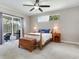 Bright main bedroom with slider door to the patio and neutral decor at 3503 Graycliff Ln, Brandon, FL 33511