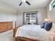 Comfortable main bedroom featuring a slider door to the patio and traditional furnishings at 3503 Graycliff Ln, Brandon, FL 33511