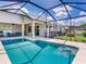 Enjoy this screened-in pool with clear blue water and a spacious deck area with outside lounging at 3503 Graycliff Ln, Brandon, FL 33511