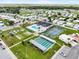 Aerial view of a charming community featuring a pool, tennis courts, shuffleboard, mini golf and more at 35045 Cynthia Ave # 35945, Zephyrhills, FL 33541