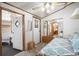 This cozy bedroom features a ceiling fan and a mirrored closet, creating a comfortable retreat at 35045 Cynthia Ave # 35945, Zephyrhills, FL 33541