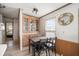 Dining area with built-in cabinets, table, and chairs, and a bright window at 35045 Cynthia Ave # 35945, Zephyrhills, FL 33541
