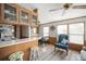 Open kitchen and dining area with a breakfast bar, cabinets, and ample counter space at 35045 Cynthia Ave # 35945, Zephyrhills, FL 33541