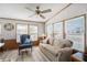 Inviting living room with a comfortable sofa, an accent chair, and wood-look flooring at 35045 Cynthia Ave # 35945, Zephyrhills, FL 33541