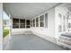 Enclosed porch area with multiple windows, providing natural light and outdoor views at 35045 Cynthia Ave # 35945, Zephyrhills, FL 33541