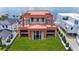 Waterfront new construction featuring a modern exterior, spacious lawn, and proximity to the water at 3611 Bayshore Ne Blvd, St Petersburg, FL 33703