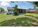 The backyard shows the patio and lush foliage at 3733 Mendocino St, New Port Richey, FL 34655