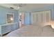 Spacious bedroom featuring ample closet space, wood floors, and an ensuite bath at 3733 Mendocino St, New Port Richey, FL 34655