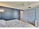 This bedroom features a ceiling fan, closet and neutral walls at 3733 Mendocino St, New Port Richey, FL 34655