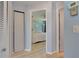 Inviting bedroom featuring wood floors, neutral paint, and a closet for ample storage at 3733 Mendocino St, New Port Richey, FL 34655