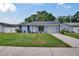 Charming single-story home with a well-manicured lawn and attached garage at 3733 Mendocino St, New Port Richey, FL 34655