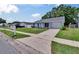 Charming single-story home with a well-manicured lawn, driveway, and mailbox at 3733 Mendocino St, New Port Richey, FL 34655