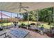 Enclosed patio featuring ceiling fan and access to the backyard at 3733 Mendocino St, New Port Richey, FL 34655