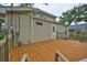 This home features a wooden deck to enjoy the nature view in the back yard at 3906 W San Luis St, Tampa, FL 33629
