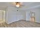 Neutral bedroom featuring wood floors, dual closets, and bright natural light at 3906 W San Luis St, Tampa, FL 33629