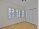Bright bedroom offers hardwood floors, plantation shutters, and a spacious closet at 3906 W San Luis St, Tampa, FL 33629