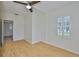 Open bedroom features hardwood floors, natural light, and a ceiling fan at 3906 W San Luis St, Tampa, FL 33629