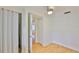 Bright bedroom features hardwood floors, closet, and a ceiling fan, adding comfort and style at 3906 W San Luis St, Tampa, FL 33629