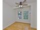 Comfortable bedroom with hardwood floors, ceiling fan, and ample natural light at 3906 W San Luis St, Tampa, FL 33629