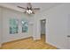Bright bedroom featuring a ceiling fan and hardwood floors at 3906 W San Luis St, Tampa, FL 33629