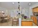 Updated kitchen featuring granite countertops, pendant lighting, tile flooring, and a cozy breakfast nook at 3906 W San Luis St, Tampa, FL 33629