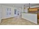 Open kitchen featuring granite countertops, pendant lighting, tile flooring, and access to the backyard at 3906 W San Luis St, Tampa, FL 33629