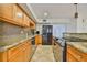 Well-equipped kitchen featuring granite countertops, stainless steel appliances and mosaic backsplash at 3906 W San Luis St, Tampa, FL 33629