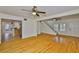 Bright living room with hardwood floors, an open floor plan, and easy access to the kitchen at 3906 W San Luis St, Tampa, FL 33629