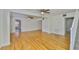 Spacious living room with gleaming hardwood floors, lots of natural light, and an open floor plan at 3906 W San Luis St, Tampa, FL 33629