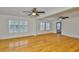 Bright living room boasting hardwood floors, a ceiling fan, lots of light, and an open floor plan at 3906 W San Luis St, Tampa, FL 33629