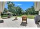 Relaxing backyard with a tiled patio and view of the lush green lawn at 4312 James L Redman Pkwy, Plant City, FL 33567
