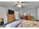 Bedroom with a dresser, a vintage vanity and bright window, offering plenty of space and storage at 4312 James L Redman Pkwy, Plant City, FL 33567