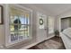 Bright entryway with a decorative rug, window, and sidelight door at 4312 James L Redman Pkwy, Plant City, FL 33567