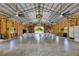 Grand event space boasts a high ceiling, fans, and customizable seating arrangements at 4312 James L Redman Pkwy, Plant City, FL 33567