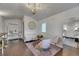 Bright interior featuring a plush pink seating arrangement, hardwood floors, and stylish decor at 4312 James L Redman Pkwy, Plant City, FL 33567
