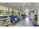 Bright sunroom with tile floors, large windows, and comfortable seating, perfect for relaxation at 4312 James L Redman Pkwy, Plant City, FL 33567