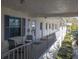 Inviting balcony featuring chairs, offering a serene outdoor seating area with natural light and fresh air at 500 Glennes Ln # 202, Dunedin, FL 34698