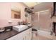 Cozy bathroom with a combined shower and bathtub, large mirror, and storage space at 500 Glennes Ln # 202, Dunedin, FL 34698