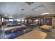 A large room in the clubhouse with tables, chairs, and pool tables offers space for recreation and community gatherings at 500 Glennes Ln # 202, Dunedin, FL 34698