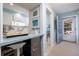 Bright, modern kitchen area with white cabinets, stainless steel appliances, and a convenient breakfast bar at 500 Glennes Ln # 202, Dunedin, FL 34698