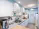 Bright kitchen with white cabinets, ample counter space, and stainless steel appliances, perfect for cooking at 500 Glennes Ln # 202, Dunedin, FL 34698