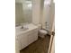 Bathroom featuring a white vanity and tiled shower-over-tub at 513 Summer Sails Dr, Valrico, FL 33594