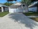 Charming single-story home with a well-maintained front yard and a two-car garage at 513 Summer Sails Dr, Valrico, FL 33594