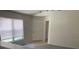 Bright open-plan living room with large windows and tiled entry at 513 Summer Sails Dr, Valrico, FL 33594
