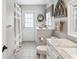 Bathroom with gray colored walls, decorative mirror and marbled countertop at 5604 Pine Bay Dr, Tampa, FL 33625
