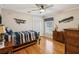 Bright bedroom with hardwood floors and nautical themed decorations at 5604 Pine Bay Dr, Tampa, FL 33625