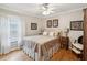 Cozy bedroom with wood floors, natural light, and neutral decor for a comfortable and inviting space at 5604 Pine Bay Dr, Tampa, FL 33625