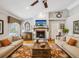 Cozy living room features a fireplace, hardwood floors, and comfortable seating for relaxing or entertaining at 5604 Pine Bay Dr, Tampa, FL 33625