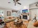 Cozy living room features a fireplace, hardwood floors, and comfortable seating for relaxing or entertaining at 5604 Pine Bay Dr, Tampa, FL 33625